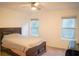 Clean bedroom with two windows and ceiling fan at 3569 Seneca Club Loop # 13, Orlando, FL 32808