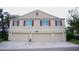 Well-maintained condominium complex offers ample parking and a welcoming facade with red shutters at 3569 Seneca Club Loop # 13, Orlando, FL 32808