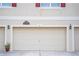 Attached garage offers secure parking, with a neutral door, exterior light fixtures, and signage at 3569 Seneca Club Loop # 13, Orlando, FL 32808