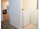 Easy access laundry area with bright lighting and white washer and dryer unit at 3569 Seneca Club Loop # 13, Orlando, FL 32808