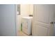 Bright laundry room with white washer and dryer unit and tiled floors at 3569 Seneca Club Loop # 13, Orlando, FL 32808