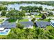 Aerial shot of home near a lake, showcasing a serene neighborhood setting with lush greenery at 4006 Kasper Dr, Orlando, FL 32806