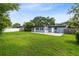 Spacious backyard featuring a well-maintained lawn with a patio area and privacy fencing at 4006 Kasper Dr, Orlando, FL 32806