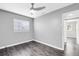 Inviting bedroom with neutral walls and fan, ready for your personal touch at 4006 Kasper Dr, Orlando, FL 32806