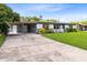 Charming home with a well-manicured lawn and covered parking at 4006 Kasper Dr, Orlando, FL 32806