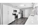 Stylish kitchen featuring white cabinets, stainless steel appliances, and sleek countertops at 4006 Kasper Dr, Orlando, FL 32806