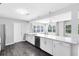 Bright kitchen features stainless steel appliances, a long breakfast bar, and plenty of natural light at 4006 Kasper Dr, Orlando, FL 32806