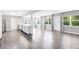 Spacious and well-lit, open-concept living area seamlessly connects to a modern kitchen at 4006 Kasper Dr, Orlando, FL 32806