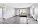 Cozy living room featuring gray laminate flooring and neutral paint, creating a welcoming space at 4006 Kasper Dr, Orlando, FL 32806