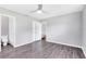Spacious bedroom with en-suite bathroom, walk-in closet, and neutral gray decor at 4006 Kasper Dr, Orlando, FL 32806