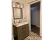 Bathroom featuring a vanity, mirror, and neutral colored walls at 421 Ohio Ave, St Cloud, FL 34769