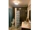Bathroom featuring a shower, toilet, sink, and neutral colored walls at 421 Ohio Ave, St Cloud, FL 34769