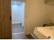 Bedroom featuring a barn door, neutral colored walls, and wood flooring at 421 Ohio Ave, St Cloud, FL 34769
