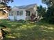 Charming single-story home with white siding and a well-manicured front lawn at 421 Ohio Ave, St Cloud, FL 34769