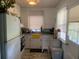 Cozy kitchen featuring white cabinetry, a window, and ample counter space at 421 Ohio Ave, St Cloud, FL 34769