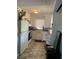 Well lit kitchen featuring white cabinets, modern appliances, and patterned flooring at 421 Ohio Ave, St Cloud, FL 34769