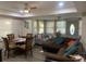 Open-concept living space with dining area, plush seating, and contemporary decor at 421 Ohio Ave, St Cloud, FL 34769