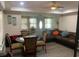 Combined living and dining area featuring comfortable seating and a modern ceiling fan at 421 Ohio Ave, St Cloud, FL 34769