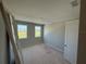 Bedroom with natural light streaming in through windows and bare walls at 441 Lady Palm St, Apopka, FL 32703