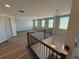Loft area with abundant natural light pouring in from large windows at 441 Lady Palm St, Apopka, FL 32703