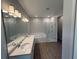 Bathroom with dual vanities, a soaking tub, and separate glass-enclosed shower at 441 Lady Palm St, Apopka, FL 32703