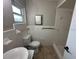 Bathroom featuring tiled walls, shower, toilet and sink at 4732 Luce Rd, Lakeland, FL 33813