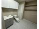 Bathroom with modern vanity, toilet, cabinets, and shelving at 4732 Luce Rd, Lakeland, FL 33813