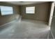 Bedroom with tile floors, neutral paint, and natural light at 4732 Luce Rd, Lakeland, FL 33813