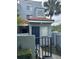 Charming two-story townhome featuring a private front entrance with a well-maintained garden and walkway at 4741 Chevy Pl # 149C2L, Orlando, FL 32811