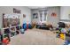 Spacious bedroom, perfect for a playroom or creative space, filled with toys and decor at 509 Cresting Oak Cir # 73, Orlando, FL 32824