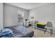 Bedroom with a desk, a bed, and ample natural light, ideal for a workspace and restful sleep at 509 Cresting Oak Cir # 73, Orlando, FL 32824