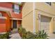 Charming home featuring colorful exteriors, an inviting entrance, and well maintained landscaping at 509 Cresting Oak Cir # 73, Orlando, FL 32824