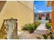 Well-maintained walkway with charming landscaping, leading to colorful townhomes with driveways at 509 Cresting Oak Cir # 73, Orlando, FL 32824