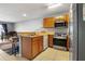Well-lit kitchen featuring stainless steel appliances, ample counter space, and an open design at 509 Cresting Oak Cir # 73, Orlando, FL 32824