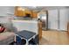 Open kitchen featuring stainless steel appliances, tile flooring, and an adjacent dining area at 509 Cresting Oak Cir # 73, Orlando, FL 32824
