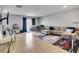 Open-concept living room with tile floors, large couch, dining table, and sliding glass doors for seamless indoor-outdoor living at 509 Cresting Oak Cir # 73, Orlando, FL 32824