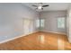 Spacious bedroom with hardwood floors, vaulted ceiling, and lots of natural light at 5703 Arnold Zlotoff Dr, Orlando, FL 32821