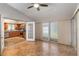 Open living space transitioning into the kitchen, perfect for entertaining at 5703 Arnold Zlotoff Dr, Orlando, FL 32821