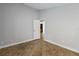 Neutral room showcasing tile flooring, fresh paint, and a view into another room at 5703 Arnold Zlotoff Dr, Orlando, FL 32821