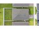 Aerial view of a single-Gathering home with a well-maintained lawn and a fenced backyard at 5808 Arboretum St, St Cloud, FL 34771