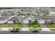 Aerial view of newly built homes showcasing the neighborhood and modern landscaping at 5808 Arboretum St, St Cloud, FL 34771