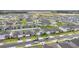 Wide aerial view showcasing many newly built modern homes in a large planned community at 5808 Arboretum St, St Cloud, FL 34771