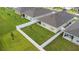 Aerial view of backyard with white fence, lush green grass, and manicured lawn at 5808 Arboretum St, St Cloud, FL 34771