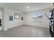 Spacious living room with neutral tile flooring, plenty of natural light, and minimalist decor at 5808 Arboretum St, St Cloud, FL 34771