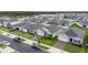 Street view featuring homes with attached garages and well-manicured lawns in a lovely neighborhood at 5808 Arboretum St, St Cloud, FL 34771