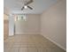 This bright bedroom features tile flooring, closet, and a window allowing for plenty of natural light at 614 Orange Dr # 196, Altamonte Springs, FL 32701