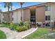 Well-maintained condo building with lush green lawns and mature palm trees at 614 Orange Dr # 196, Altamonte Springs, FL 32701