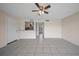 Bright, open living room featuring tile flooring and a ceiling fan for comfortable living at 614 Orange Dr # 196, Altamonte Springs, FL 32701