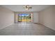 Bright living space offers a calming ceiling fan and serene views from its sliding glass doors at 614 Orange Dr # 196, Altamonte Springs, FL 32701