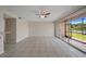 Bright living area with a sliding glass door that welcomes natural light and a cooling ceiling fan at 614 Orange Dr # 196, Altamonte Springs, FL 32701